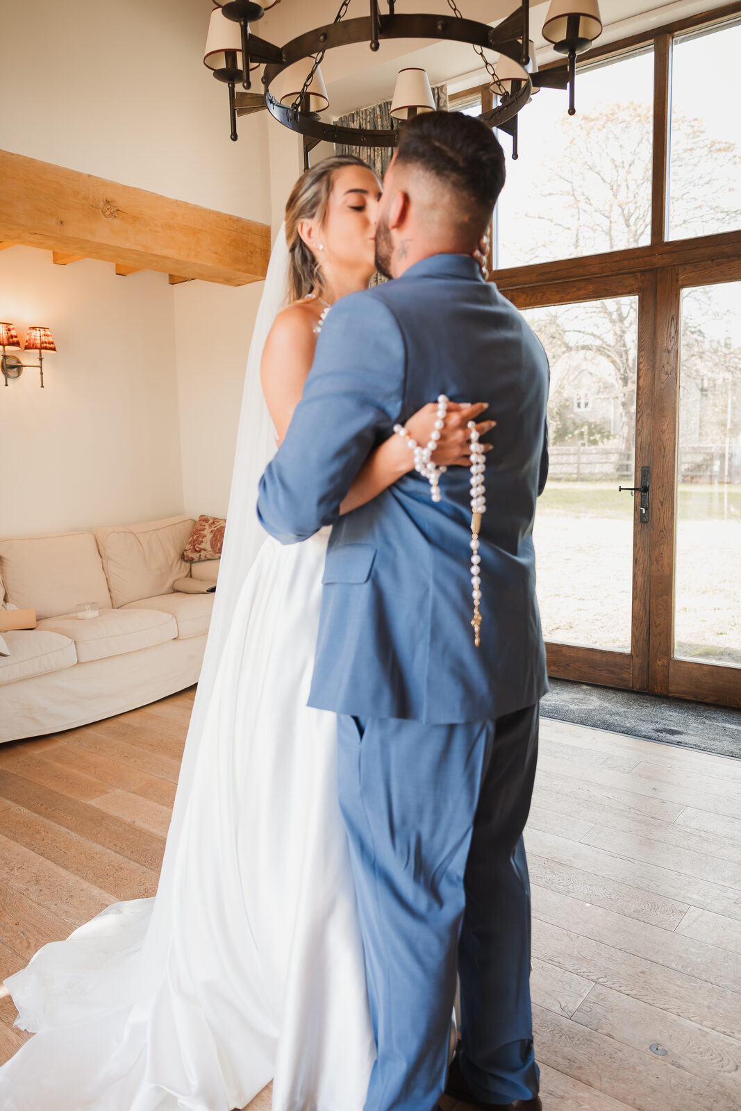 A couple photographed in a field at an Azoos Events wedding